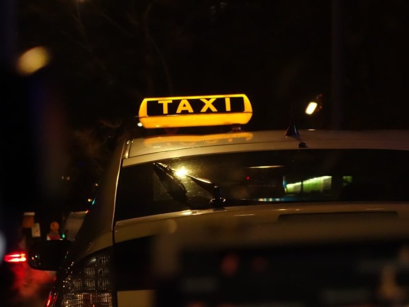 yellow taxi cab on road during night time